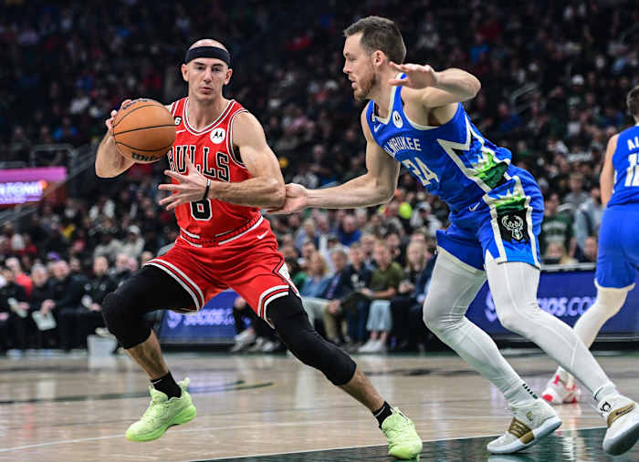 Chicago Bulls guard Alex Caruso (6) is guarded by Milwaukee Bucks guard Pat Connaughton (24)